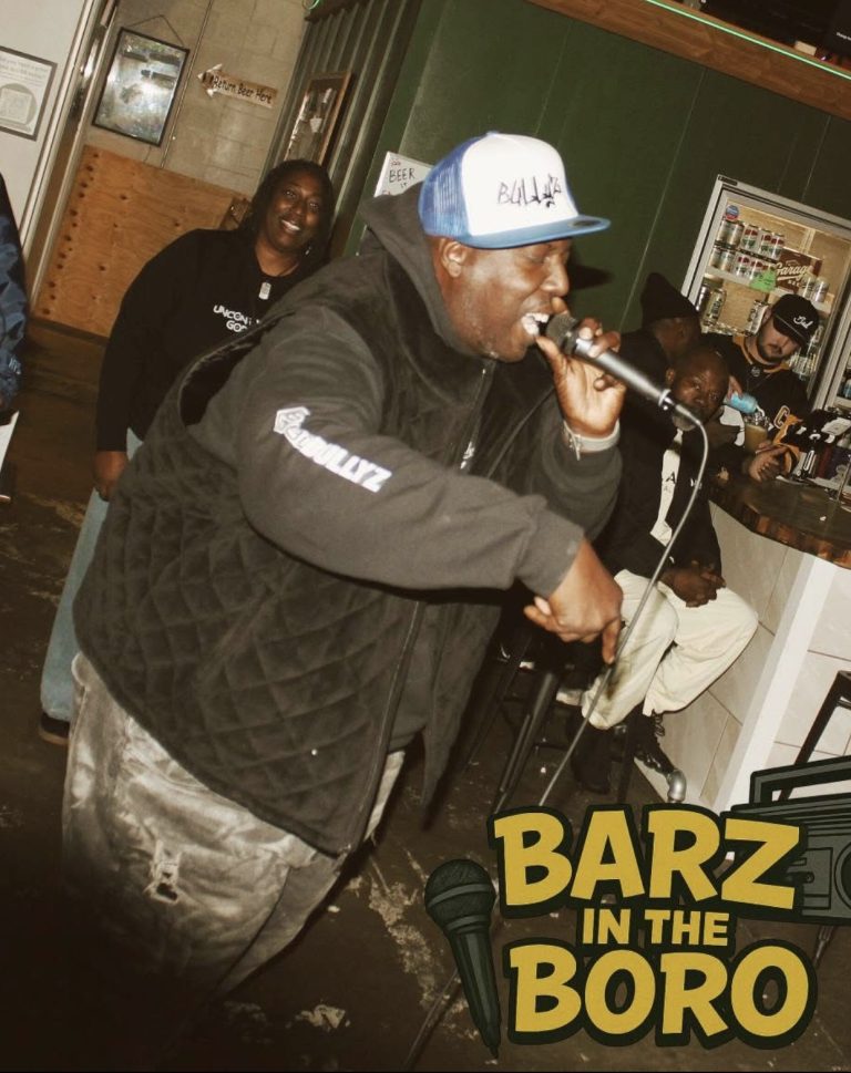 Rapper performing Bullyz trucker hat barz in the boro
